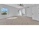 Primary bedroom with large windows and carpet at 2120 N 125Th Ave, Avondale, AZ 85392