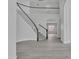 Elegant entryway with a curved staircase and hardwood floors at 2120 N 125Th Ave, Avondale, AZ 85392