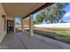 Covered patio, grassy yard, and a block wall at 2120 N 125Th Ave, Avondale, AZ 85392