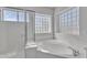 Bathroom featuring a large garden tub and a walk-in shower at 2120 N 125Th Ave, Avondale, AZ 85392