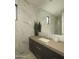 Elegant bathroom with marble tile and a modern vanity at 22423 N 89Th St, Scottsdale, AZ 85255