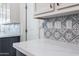 Modern kitchen backsplash with geometric patterned tiles at 7750 E Broadway Rd # 723, Mesa, AZ 85208