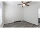 Spacious bedroom with wood-look flooring and ceiling fan at 7750 E Broadway Rd # 723, Mesa, AZ 85208