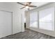 Bright bedroom with double door closet and wood-look flooring at 7750 E Broadway Rd # 723, Mesa, AZ 85208