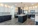 Modern kitchen with island, stainless steel appliances, and white cabinets at 7750 E Broadway Rd # 723, Mesa, AZ 85208