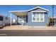 Charming blue exterior with covered porch and landscaping at 7750 E Broadway Rd # 723, Mesa, AZ 85208