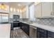 Modern kitchen with stainless steel appliances and designer backsplash at 7750 E Broadway Rd # 723, Mesa, AZ 85208