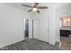 Simple bedroom with wood-look flooring and double door closet at 7750 E Broadway Rd # 723, Mesa, AZ 85208
