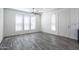 Bright living room with wood-look flooring and ceiling fan at 7750 E Broadway Rd # 723, Mesa, AZ 85208