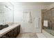 Bathroom features a shower/tub combo and double sinks at 8530 E Pepper Tree Ln, Scottsdale, AZ 85250