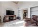 Bright Gathering room featuring built-in shelving and comfortable seating at 8530 E Pepper Tree Ln, Scottsdale, AZ 85250