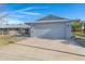 Ranch style home with attached garage and landscaped front yard at 10114 W Candlewood Dr, Sun City, AZ 85351