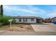 Front exterior view of a single-story home with a carport at 1641 W Grovers Ave, Phoenix, AZ 85023