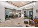 Private courtyard with tiled flooring, multiple access points, and views of the kitchen and living spaces at 17197 W Thousand Oaks St, Surprise, AZ 85388