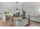 Open concept kitchen with large island, granite countertops, and stainless steel appliances at 17197 W Thousand Oaks St, Surprise, AZ 85388
