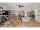 Open concept living space with comfortable seating, built-in shelving, and access to the kitchen at 17197 W Thousand Oaks St, Surprise, AZ 85388