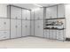 Organized garage with ample storage cabinets and work bench at 17404 E Monument Ct, Rio Verde, AZ 85263