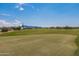 Expansive green golf course with mountain views at 17404 E Monument Ct, Rio Verde, AZ 85263