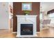 White fireplace with a modern electric insert at 3301 S Goldfield Rd # 1009, Apache Junction, AZ 85119