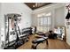 Home gym with weight machine, dumbbells, and mirrored walls at 5112 E Pasadena Ave, Phoenix, AZ 85018