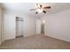Bedroom with double closet and carpeted floors at 16847 S 13Th Way, Phoenix, AZ 85048