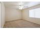 Bright bedroom with ceiling fan and window blinds at 16847 S 13Th Way, Phoenix, AZ 85048