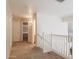 Upstairs hallway with carpeted flooring and access to bedrooms at 16847 S 13Th Way, Phoenix, AZ 85048