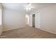 Spacious bedroom with ceiling fan and double doors leading to the closet at 16847 S 13Th Way, Phoenix, AZ 85048