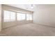 Bright bedroom with large windows and ceiling fan at 16847 S 13Th Way, Phoenix, AZ 85048