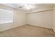 Well-lit bedroom featuring a large window and ceiling fan at 16847 S 13Th Way, Phoenix, AZ 85048