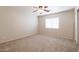 Spacious bedroom with carpeted floors and ceiling fan at 16847 S 13Th Way, Phoenix, AZ 85048