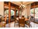 Bright dining area with a large table and access to a patio at 27440 N Alma School Pkwy # 33-1, Scottsdale, AZ 85262