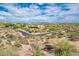 Aerial view of a luxury home community with a winding road and desert landscape at 27440 N Alma School Pkwy # 33-1, Scottsdale, AZ 85262