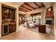 Living room with a fireplace, built-in shelving, and large windows at 27440 N Alma School Pkwy # 33-1, Scottsdale, AZ 85262