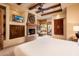 Large bedroom featuring a fireplace and backyard view at 27440 N Alma School Pkwy # 33-1, Scottsdale, AZ 85262
