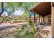 Covered entryway with wooden beams, desert landscaping, and mountain views at 27440 N Alma School Pkwy # 33-1, Scottsdale, AZ 85262