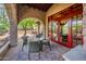 Covered patio with dining area and red doors at 27440 N Alma School Pkwy # 33-1, Scottsdale, AZ 85262