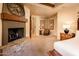 Serene bedroom with fireplace and sitting area at 27440 N Alma School Pkwy # 33-1, Scottsdale, AZ 85262