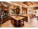 Open concept kitchen with an island and breakfast bar at 27440 N Alma School Pkwy # 33-1, Scottsdale, AZ 85262
