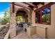 Built-in outdoor kitchen with grill and prep area at 27440 N Alma School Pkwy # 33-1, Scottsdale, AZ 85262