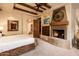 Comfortable bedroom with fireplace and access to bathroom at 27440 N Alma School Pkwy # 33-1, Scottsdale, AZ 85262