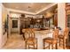 Modern kitchen with granite counters, stainless steel appliances, and wood cabinets at 27440 N Alma School Pkwy # 33-1, Scottsdale, AZ 85262