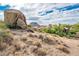 Aerial view of luxury homes situated amongst desert landscape and rock formations at 27440 N Alma School Pkwy # 33-1, Scottsdale, AZ 85262