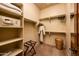 Large walk-in closet with ample shelving and hanging space at 27440 N Alma School Pkwy # 33-1, Scottsdale, AZ 85262