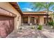 Home entrance with a covered walkway, wooden beams, and a courtyard at 27440 N Alma School Pkwy # 33-1, Scottsdale, AZ 85262