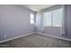 Spacious bedroom with window, blinds, and carpet flooring at 10013 E Trent Ave, Mesa, AZ 85212