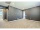 Large bedroom with gray walls and carpeted floors at 10013 E Trent Ave, Mesa, AZ 85212