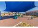 Playground with shade structure and play equipment at 10013 E Trent Ave, Mesa, AZ 85212