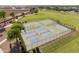 Aerial view of community sports courts, including basketball and pickleball at 38075 W Excussare Way, Maricopa, AZ 85138