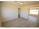 Bright and spacious living room with hardwood floors and large windows at 2018 N 52Nd Dr, Phoenix, AZ 85035